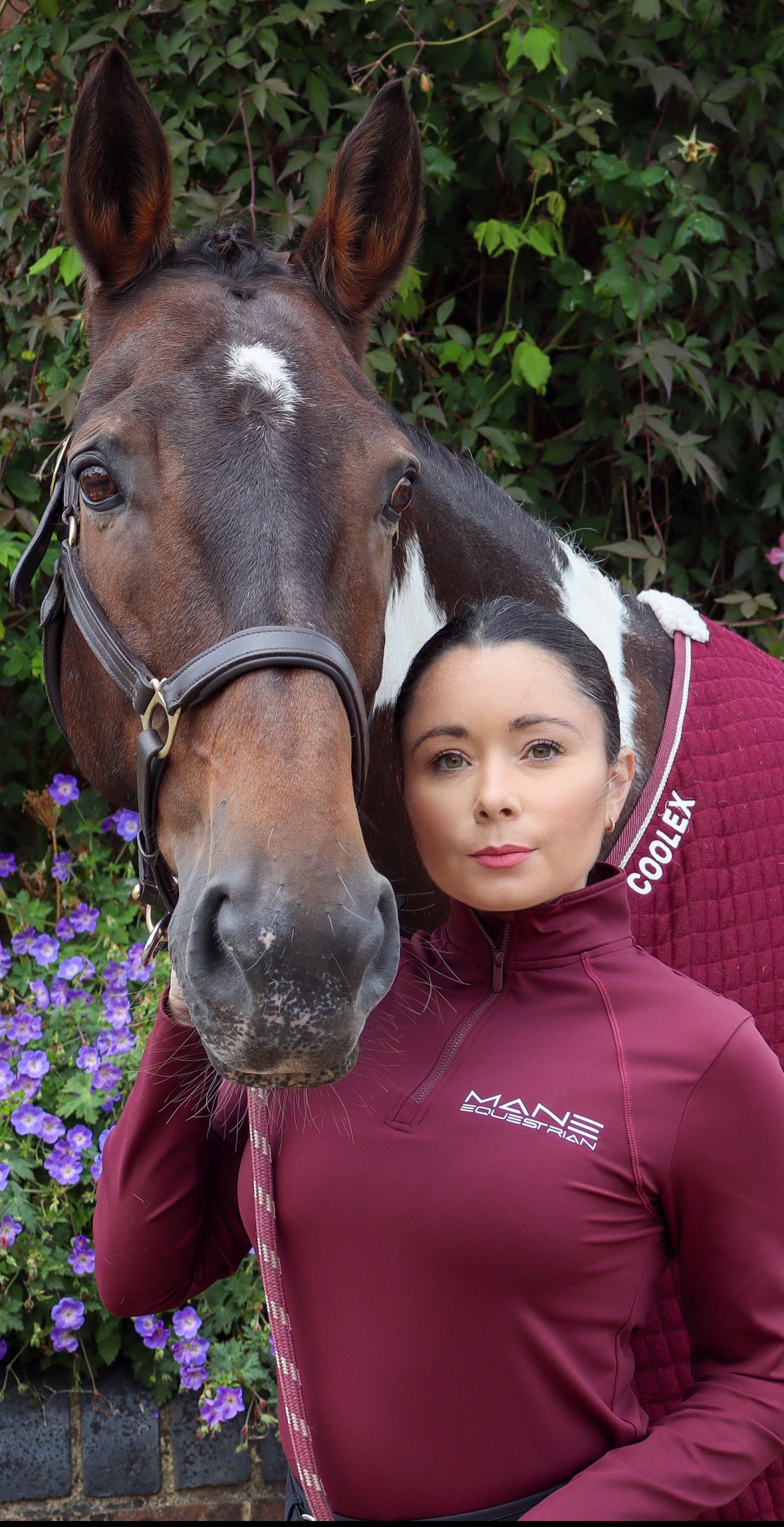 A person wearing a burgundy long sleeved base layer 
